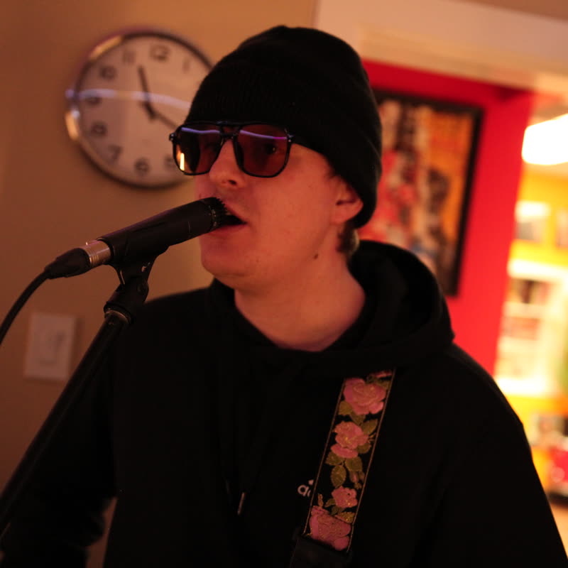 Spencer during a guitar-focused rehearsal moment