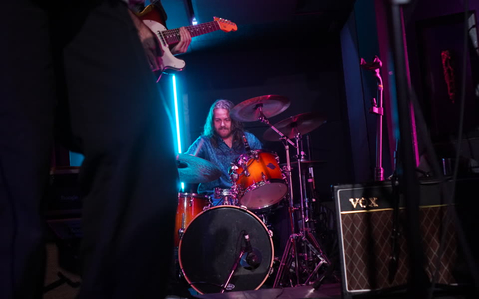 Kevin playing drums at Painted Lady