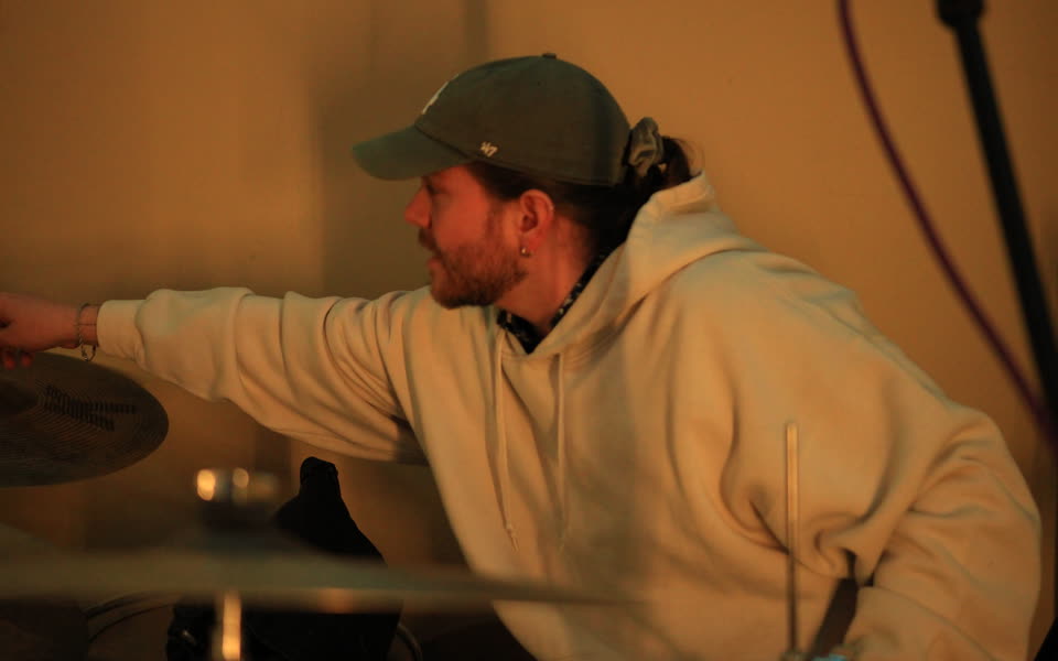 Kevin recording drums during the BTS session